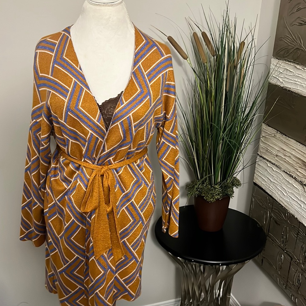 Sparkle in this cute wrap dress or knee length cover up.